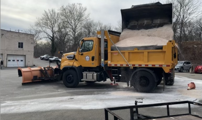 Snow plow getting sand Darien DPW